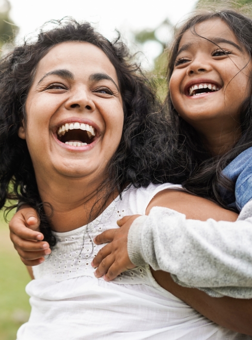 happy-indian-mother-having-fun-with-her-daughter-outdoo